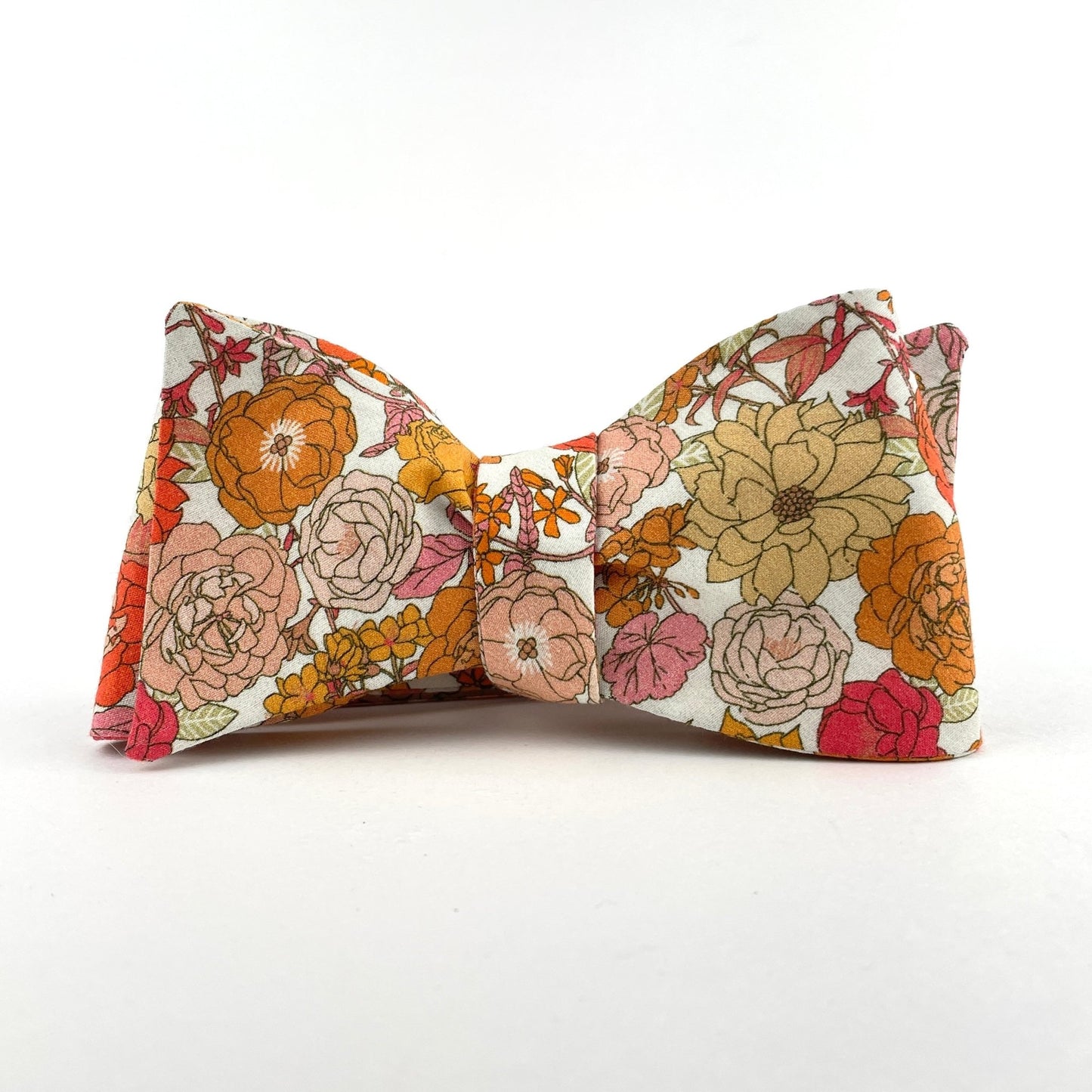 Floral bowtie with orange pink and peach flowers made in America