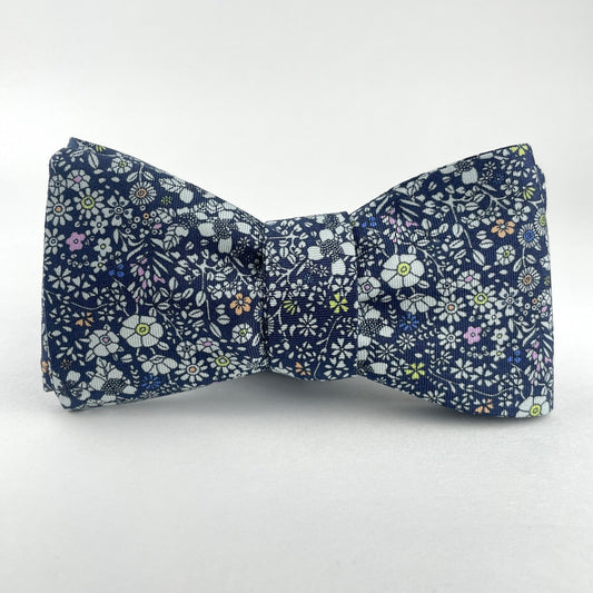 Blue bowtie with multicolored flowers made in America