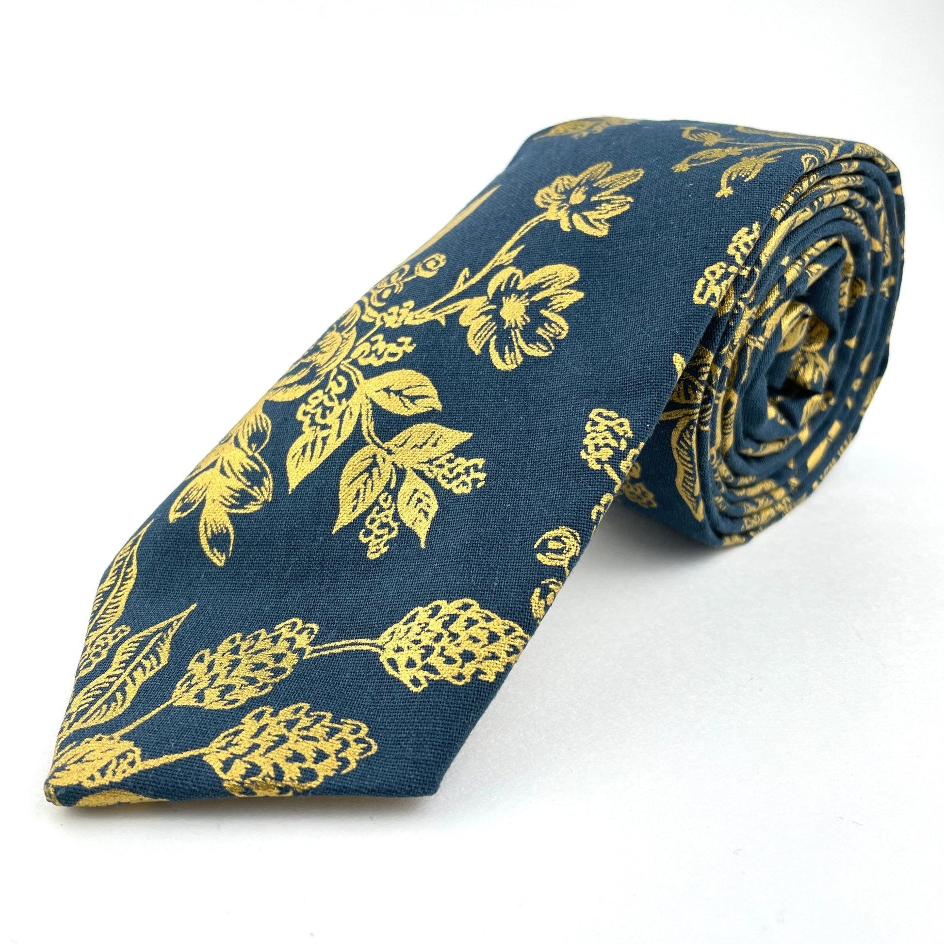 Blue neck tie with gold floral pattern made in America